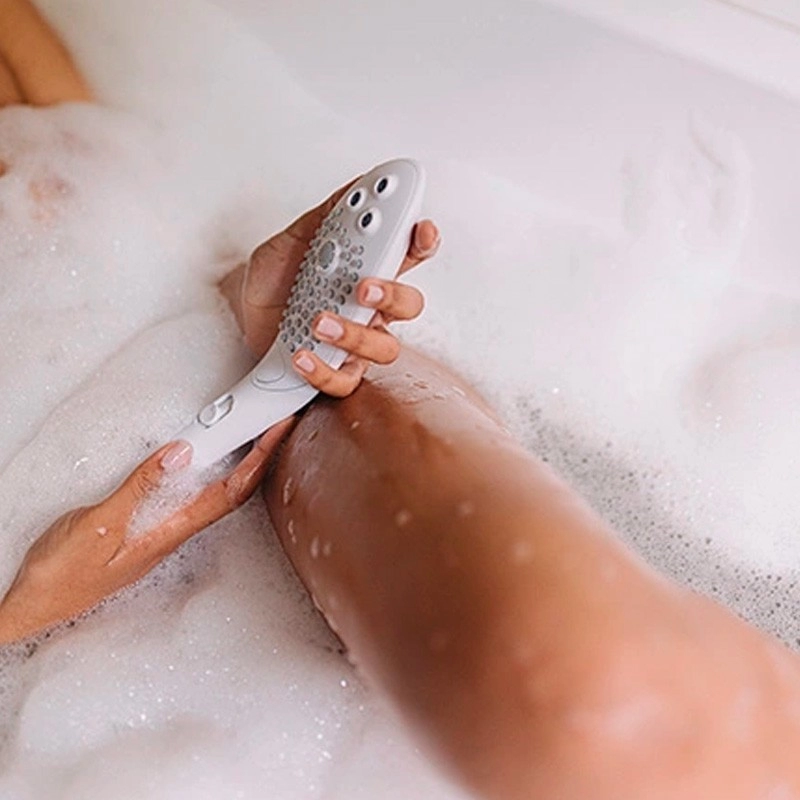 Pommeau de douche intime Womanizer Wave - Blanc